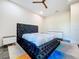 Modern bedroom features a luxurious bed, stylish decor, and sleek tile floors at 5603 Tybee Island Dr, Apollo Beach, FL 33572