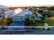 Charming waterfront home boasting lush landscaping, a paver driveway, and a durable metal roof at 5603 Tybee Island Dr, Apollo Beach, FL 33572
