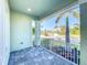 Charming front porch view showcasing the manicured landscaping and beautiful neighborhood street at 5603 Tybee Island Dr, Apollo Beach, FL 33572