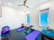 Bright home gym featuring exercise equipment, rubber flooring, and large windows for ample natural light at 5603 Tybee Island Dr, Apollo Beach, FL 33572