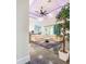 Bright living room features stylish decor, tile floors, and a sliding door leading to outdoor area at 5603 Tybee Island Dr, Apollo Beach, FL 33572