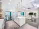 Open living space featuring kitchen island, dining table, tile floors, and sectional couch at 5603 Tybee Island Dr, Apollo Beach, FL 33572