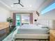 A bright main bedroom with a sliding glass door and minimalist decor at 5603 Tybee Island Dr, Apollo Beach, FL 33572