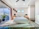 Bright main bedroom with a plush bed, outdoor view, and calming decor for a peaceful retreat at 5603 Tybee Island Dr, Apollo Beach, FL 33572
