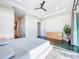 Open main bedroom with a plush bed, lots of space, natural light, and a calming aesthetic for peaceful relaxation at 5603 Tybee Island Dr, Apollo Beach, FL 33572