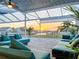 Covered patio featuring comfortable seating and views of the canal at sunset at 5603 Tybee Island Dr, Apollo Beach, FL 33572