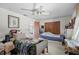 Inviting bedroom with a ceiling fan, spacious closet, and comfortable beds at 588 Bayview Dr, Longboat Key, FL 34228