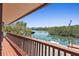 Relaxing wooden deck with waterway views at 588 Bayview Dr, Longboat Key, FL 34228