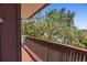 Cozy deck with views of trees and heron at 588 Bayview Dr, Longboat Key, FL 34228