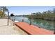Private dock with access to peaceful waters and lush surroundings at 588 Bayview Dr, Longboat Key, FL 34228