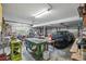 Spacious garage with a car, tools and a workbench, providing ample space for parking and storage at 588 Bayview Dr, Longboat Key, FL 34228