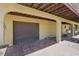 Open garage with tile flooring, concrete parking, and direct access to the house at 588 Bayview Dr, Longboat Key, FL 34228
