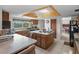 Bright eat-in kitchen featuring an island, wood cabinets, and view to the dining area at 588 Bayview Dr, Longboat Key, FL 34228