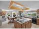 Open kitchen features eat-in space and views of living room and waterfront at 588 Bayview Dr, Longboat Key, FL 34228