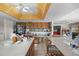 Spacious kitchen featuring long countertops, a kitchen island, and an eat-in area at 588 Bayview Dr, Longboat Key, FL 34228