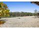 Gravel yard overlooking waterfront and dock at 588 Bayview Dr, Longboat Key, FL 34228