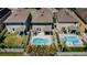 Aerial view of a fenced backyard, a patio, and a kidney-shaped in-ground pool at 5928 81St N Ave, Pinellas Park, FL 33781