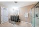 Spacious main bathroom with double vanity and glass-enclosed shower at 5928 81St N Ave, Pinellas Park, FL 33781