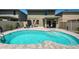 In-ground pool and patio with shaded outdoor seating area, and privacy fence at 5928 81St N Ave, Pinellas Park, FL 33781