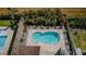 Aerial view of the in-ground pool surrounded by paving stones and a privacy fence at 5928 81St N Ave, Pinellas Park, FL 33781