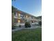 Exterior of a two-story building with walkways, staircases, and green spaces at 5940 21St N St # 11, St Petersburg, FL 33714