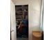 Small closet with shelving filled with cleaning supplies and tools at 5940 21St N St # 11, St Petersburg, FL 33714