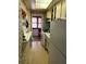 Efficient kitchen layout featuring essential appliances and ample cabinet storage at 5940 21St N St # 11, St Petersburg, FL 33714