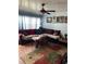 Comfortable living room with a fan, area rug, throw pillows and hardwood floors at 5940 21St N St # 11, St Petersburg, FL 33714