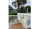 Outdoor shower by the pool with warning sign, shallow water at 5940 21St N St # 11, St Petersburg, FL 33714