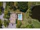 Aerial view of the pool and recreational area, nestled among lush landscaping, and ample parking available at 6070 80Th N St # 308, St Petersburg, FL 33709