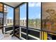Relaxing enclosed balcony with panoramic views of the lake and nearby buildings at 6070 80Th N St # 308, St Petersburg, FL 33709
