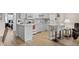 Well-appointed kitchen featuring white cabinets and a breakfast bar, seamlessly flowing into living spaces at 6070 80Th N St # 308, St Petersburg, FL 33709
