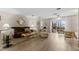 Comfortable living room with plush seating, hardwood flooring, and a view to the outdoors at 6070 80Th N St # 308, St Petersburg, FL 33709