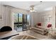 Inviting living room with a sliding door to the outside balcony and comfortable furniture at 6070 80Th N St # 308, St Petersburg, FL 33709
