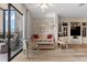 Bright living room with natural light from sliding glass door, featuring modern decor and a ceiling fan at 6070 80Th N St # 308, St Petersburg, FL 33709