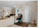 Compact office space area adjacent to the living room, featuring laminate floors at 6070 80Th N St # 308, St Petersburg, FL 33709
