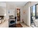 Office with closet, desk, and printer provides a functional workspace near the living area and the sliding glass door at 6070 80Th N St # 308, St Petersburg, FL 33709