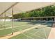 Community shuffleboard court with shaded seating, perfect for outdoor recreation at 6070 80Th N St # 308, St Petersburg, FL 33709