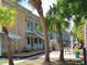 Beautiful condo building with tropical landscaping and inviting outdoor seating area at 6100 21St N St # 17, St Petersburg, FL 33714