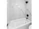 Close-up of a modern tiled shower and bathtub in a renovated bathroom at 6204 Nebraska Ave, New Port Richey, FL 34653