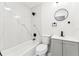 Sleek bathroom showcasing marble-look tile, a tub, and a modern vanity at 6204 Nebraska Ave, New Port Richey, FL 34653