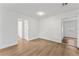 Clean bedroom with neutral walls, wood-look floors, and ample natural light for a restful atmosphere at 6204 Nebraska Ave, New Port Richey, FL 34653