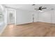 Spacious living room with wood flooring, abundant natural light, and neutral paint, great for entertaining at 6204 Nebraska Ave, New Port Richey, FL 34653