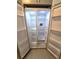 Spacious side-by-side refrigerator with adjustable shelving, ready for groceries at 6204 Nebraska Ave, New Port Richey, FL 34653