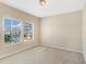 Inviting carpeted bedroom with natural light from large windows at 7410 S Fitzgerald St, Tampa, FL 33616