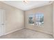 Cozy carpeted bedroom featuring a double window for natural light at 7410 S Fitzgerald St, Tampa, FL 33616
