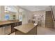 Stylish kitchen featuring granite countertops, stainless appliances, and an adjoining dining area at 7410 S Fitzgerald St, Tampa, FL 33616