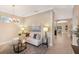 Inviting living space with comfortable seating, a decorative rug, and an open layout at 7410 S Fitzgerald St, Tampa, FL 33616