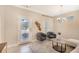 Bright living area featuring stylish furniture, neutral colors, and a cozy ambiance for relaxation at 7410 S Fitzgerald St, Tampa, FL 33616