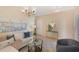 Cozy living room showcasing a plush sofa, decorative pillows, and plenty of natural light at 7410 S Fitzgerald St, Tampa, FL 33616